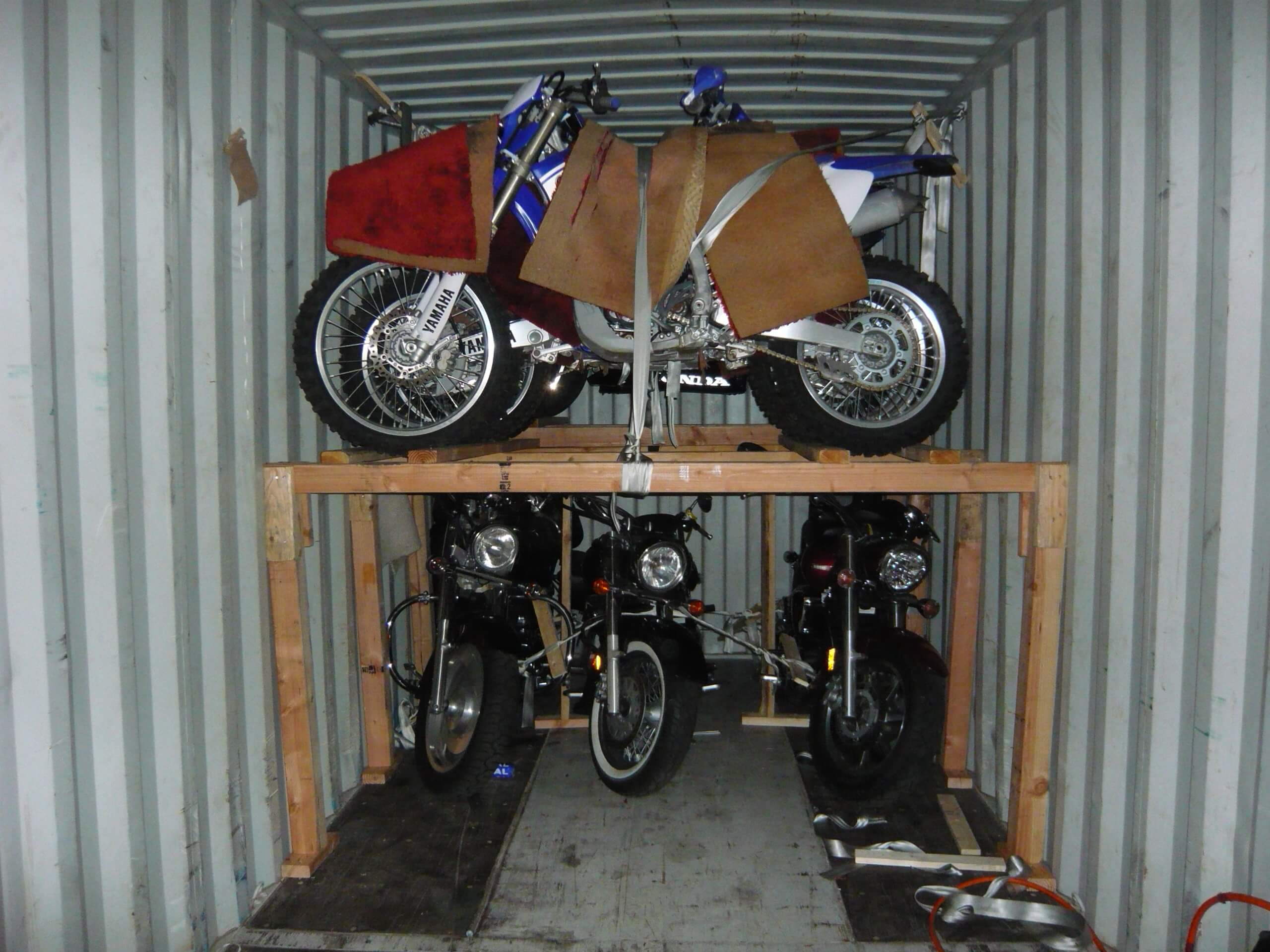 Motorcycle shipping container with wooden braces.